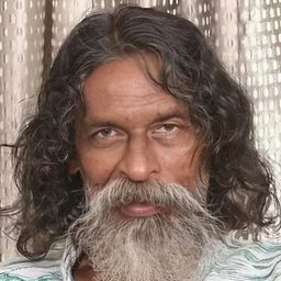 Ashraf Mallisery 飾演 Arumugam