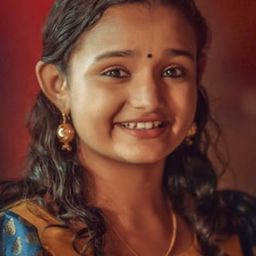 Meenakshi 飾演 Isha