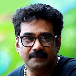 比朱·梅農 飾演 Ammini Pilla