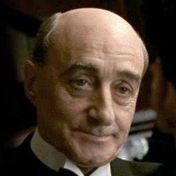 David Warrilow 飾演 Garland Stanford