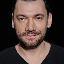 Dominik Bąk 飾演 Executioner Smietanski