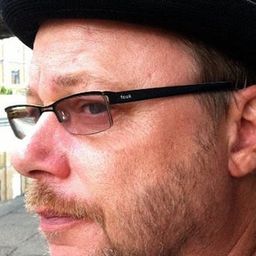 Graham Fletcher-Cook 飾演 Market Trader