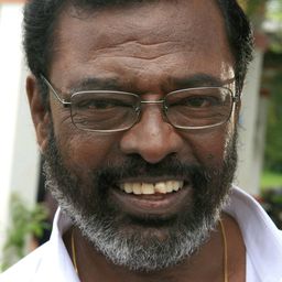 Manivannan 飾演 Auto Driver